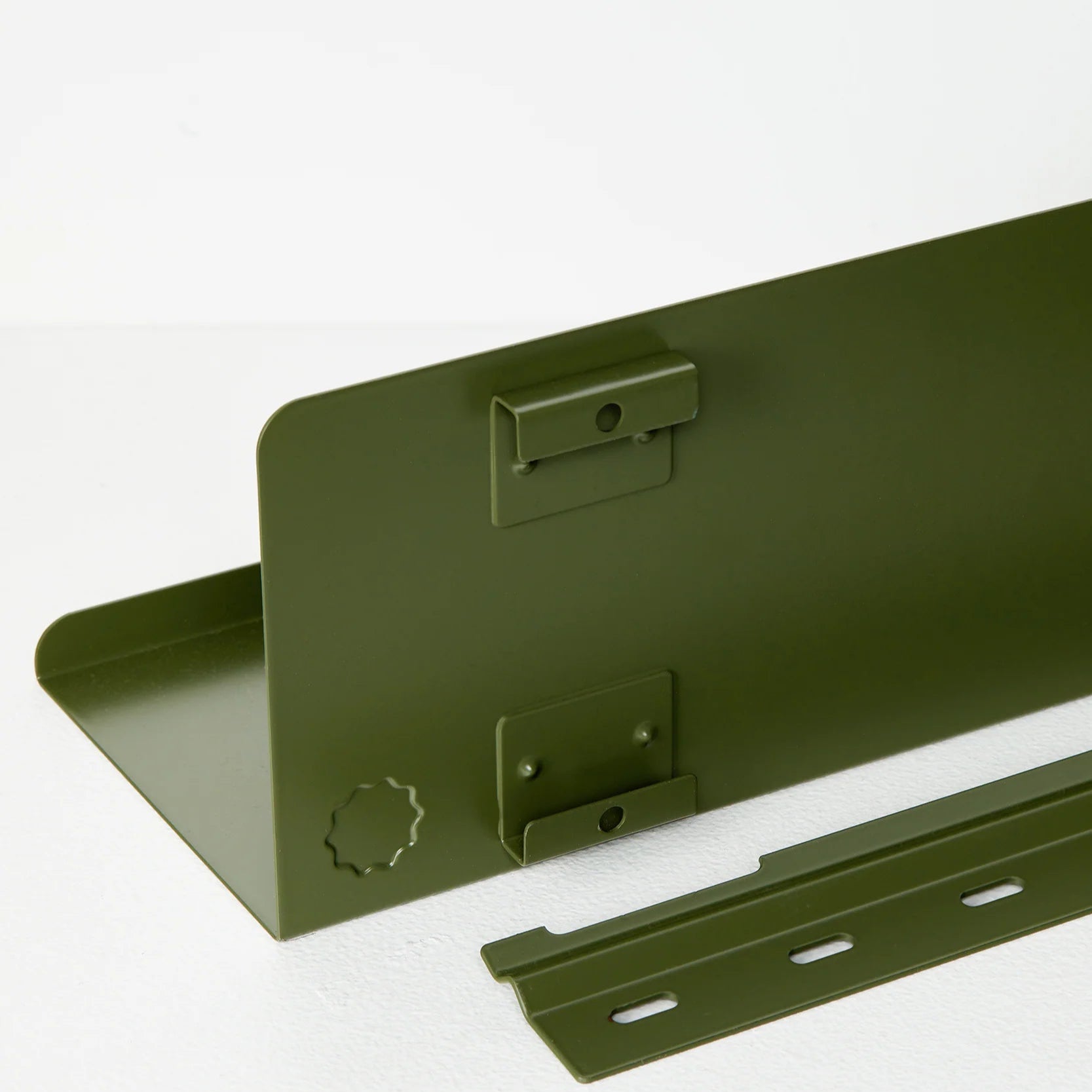 Dark green metal bracket on a white background