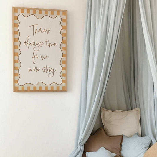 Children's bedroom with a bed, teddy bear, and framed quote on the wall.