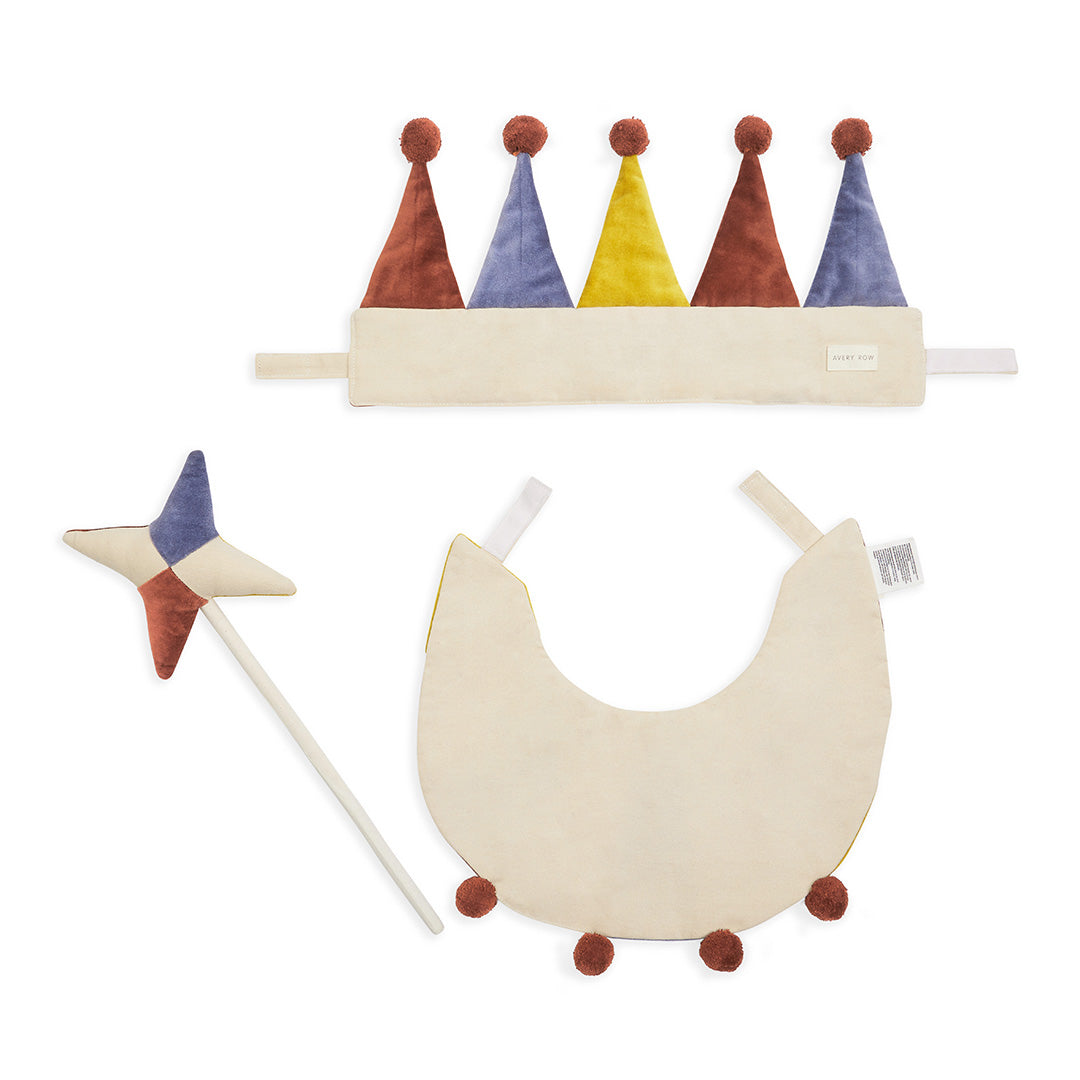 Colorful children's crown, wand, and crescent moon toy on a white background